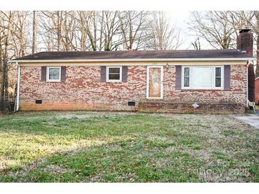 Charming brick ranch home with a well-maintained lawn and inviting front entrance at 393 Carson Dr, Gastonia, NC 28052