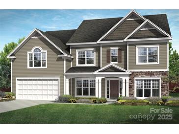 Charming two-story home featuring a stone facade, inviting front porch, and a well-manicured lawn at 4244 Dahlia Dr # Cge0036, Harrisburg, NC 28075