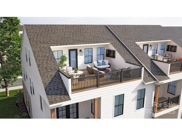 Charming rooftop deck with cozy seating, dining area, and scenic views, perfect for outdoor relaxation and entertaining at 5052 Elm View Dr # 16, Charlotte, NC 28277