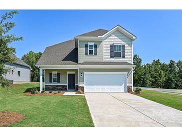 Charming two-story home featuring a two-car garage, and a well-manicured lawn at 2206 Catawba Trace Dr, Catawba, NC 28609