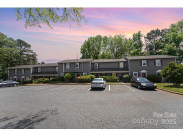 Charming two-story townhouse with ample parking in front at 3131 Heathstead Pl, Charlotte, NC 28210