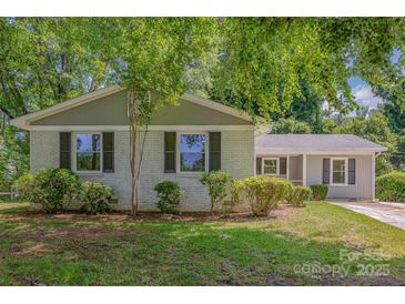 Charming single-story home featuring a freshly painted exterior, well-maintained landscaping, and inviting curb appeal at 6007 Charing Pl, Charlotte, NC 28211