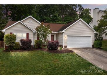 Charming one-story home boasts manicured lawn, fresh landscaping, and a two-car garage at 508 Long Creek Pkwy, Charlotte, NC 28214