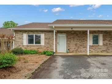 Charming brick home with a covered front porch and well-manicured landscaping at 505 2Nd Street Ne Pl # B2, Conover, NC 28613