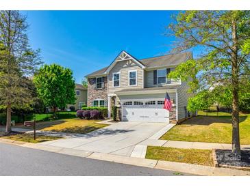 Charming two-story home with well-maintained lawn, driveway and two-car garage at 5070 Saint Clair St, Fort Mill, SC 29715