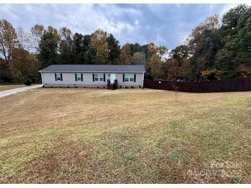 Charming single-story home featuring a well-maintained lawn and a classic facade at 119 Marietta Rd, Mooresville, NC 28117