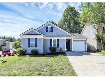 Charming single-story home with a well-manicured lawn and attached one car garage at 9212 Scotts Elm Ct, Charlotte, NC 28215