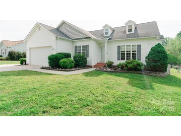 Charming one story home with well maintained lawn and landscaped garden beds at 135 Meadow Lake Dr, Salisbury, NC 28146