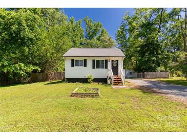 Charming single-story home with white siding, black shutters, and a well-maintained lawn at 201 Trinity St, Clover, SC 29710