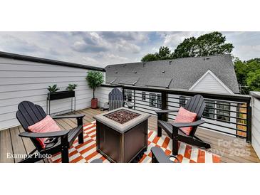 Inviting deck area with comfortable seating and a modern fire pit for outdoor relaxation at 514 Lockwood Creek Dr # 30, Charlotte, NC 28208