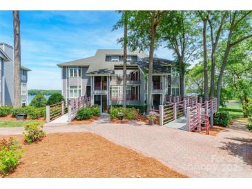 Beautiful lakefront condo with multiple balconies and lush landscaping at 803 Lake Club Dr, Rock Hill, SC 29732