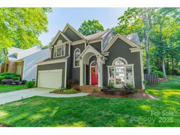Charming home with a red front door, well-maintained lawn, and inviting curb appeal at 4201 Beauvista Dr, Charlotte, NC 28269