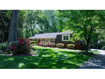 Charming single-Gathering home with lush landscaping and well-maintained lawn at 701 5Th Ne Ave, Conover, NC 28613