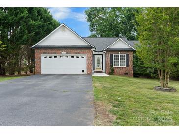 Charming single-story brick home with a well-maintained lawn and attached two-car garage at 103 Pine Meadows Cir, Hickory, NC 28601