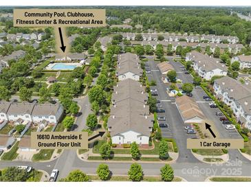 Aerial view showcases the community's pool, clubhouse, recreational area, garage, and ground floor unit at 16610 Amberside E Rd, Cornelius, NC 28031