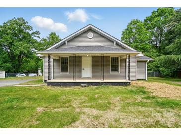 Charming single-story home with a welcoming front porch and gray siding at 842 Murphy St, Kannapolis, NC 28081