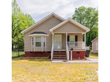 Charming one-story home features a welcoming front porch and manicured lawn at 420 Baker Street Ext, Rock Hill, SC 29730