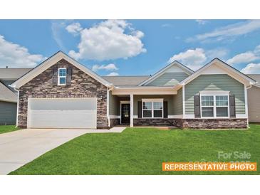 Charming home featuring a stone facade, well-manicured lawn, and a welcoming covered porch at 6320 Busch Way, Midland, NC 28107