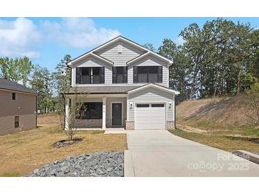 Charming two-story home with gray siding, black shutters, and a welcoming front porch at 1837 Bear St, Charlotte, NC 28214