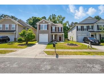 Charming two-story home featuring neutral siding, red shutters, a manicured lawn, and attached single-car garage at 6430 Matlea Ct, Charlotte, NC 28215