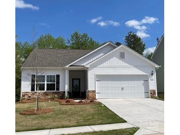 Charming one-story home featuring white siding, stone accents, and a two-car garage in a desirable neighborhood at 1532 Doran Ter, Richburg, SC 29729