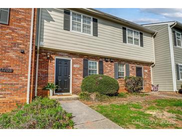 Charming brick townhome with well-maintained lawn and inviting black front door at 3109 Heathstead Pl, Charlotte, NC 28210