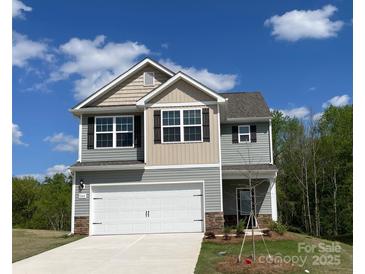 Charming two-story home featuring a mix of lap siding and a two car garage at 1544 Doran Ter, Richburg, SC 29729
