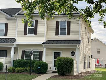 Charming two-story townhome with light siding, dark shutters, and well-maintained landscaping at 11622 Lioness St, Charlotte, NC 28273