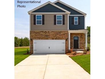Charming two-story home with a two-car garage and manicured lawn at 156 Parker Claire Ln, Kings Mountain, NC 28086
