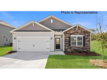 Charming single-story home with a two-car garage, stone accents and a well-manicured lawn at 249 Giant Oak Ave, Statesville, NC 28677