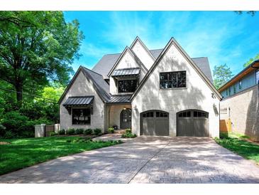 Stunning two-story home featuring a symmetrical facade and gray-tone brick at 3524 Lacie Ln, Charlotte, NC 28211