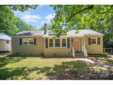 Charming one-story home with a brick exterior, inviting front porch, and a well-maintained lawn at 3529 Trent St, Charlotte, NC 28209