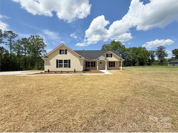 Charming single-story home featuring a manicured lawn and classic architectural details at 3650 Sentry Rd, Lancaster, SC 29720