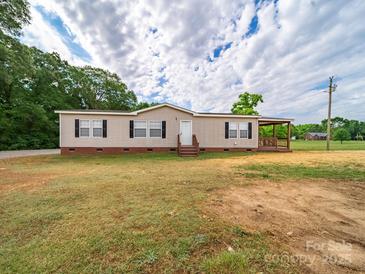 Charming single-story home with covered front porch and black shutters at 4328 Camden Rd, Marshville, NC 28103