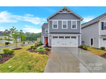 Two-story home with gray siding, white trim, a bright red front door, and an attached white two-car garage at 3212 Coast Oak Rd, Charlotte, NC 28214