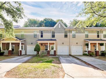 Inviting townhouse exteriors with attached garages, front porches, and well-maintained landscaping at 5943 Pisgah Way, Charlotte, NC 28217