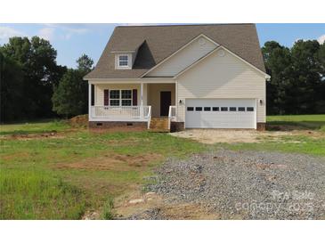 Charming home featuring light siding, a covered porch, and an attached garage with ample parking space at 144 Mason Tanner Ct, Rock Hill, SC 29730