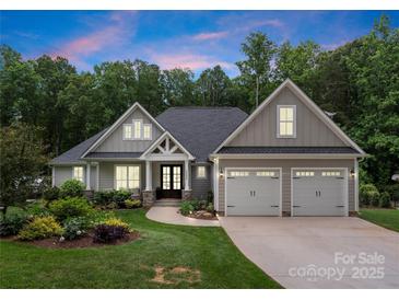 Charming craftsman home with a landscaped front yard and two-car garage offers great curb appeal at 2646 Lee Lawing Rd, Lincolnton, NC 28092