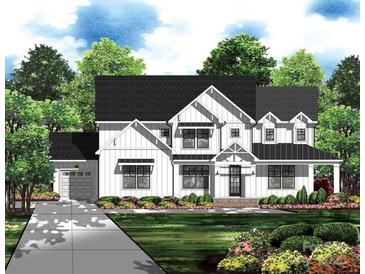 Charming two-story modern farmhouse with board and batten siding, black trim, and a covered porch at 4095 Kingfisher Dr, York, SC 29745