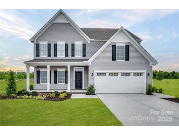 Inviting two-story home with gray siding, black shutters, and a two-car garage showcasing classic suburban charm at 523 Lenswood Ct, Denver, NC 28037