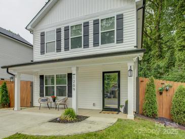 Inviting front porch with stylish seating and classic architectural details at 1209 Gaston Ave, Gastonia, NC 28052