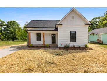 Charming renovated home with a well-maintained front yard, and inviting porch at 317 S Pink St, Cherryville, NC 28021