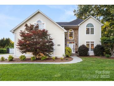 Charming home with stone accents, manicured lawn, and mature tree at 3340 Blue Jay Pass, Fort Mill, SC 29708