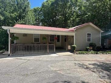 Charming home with a covered front porch, perfect for relaxing and enjoying the outdoors at 3690 Birchwood Ln, Denver, NC 28037