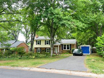 Charming two-story home with a well-manicured front yard and driveway at 4315 Chandworth Rd, Charlotte, NC 28210