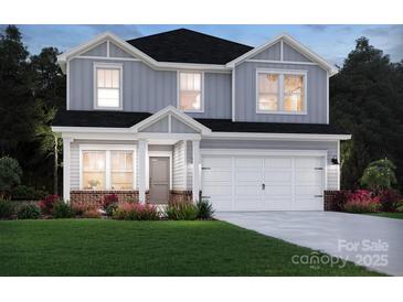 Charming two-story home with light grey siding, white trim, and a two-car garage at 1210 Morehead Dr, Salisbury, NC 28144