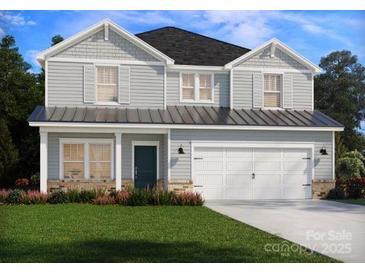 Charming two-story home with gray siding, a two-car garage, and a well-manicured lawn at 2159 Sunflower Cir, Newton, NC 28658