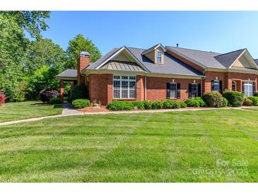 Charming brick home featuring a manicured lawn, mature landscaping, and inviting curb appeal at 532 Wilmslow Rd, Rock Hill, SC 29730