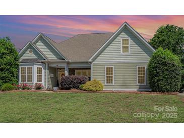 Charming single-story home with well-manicured lawn and lush landscaping at 6603 Havencrest Dr, Denver, NC 28037
