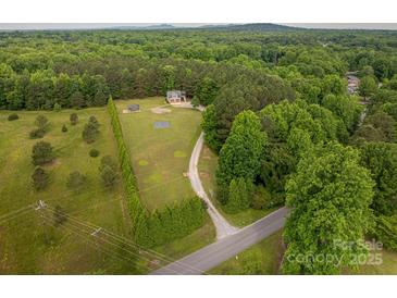 A beautiful, wooded, aerial view of the home and surrounding landscape at 2609 Cove Creek Dr, Gastonia, NC 28056